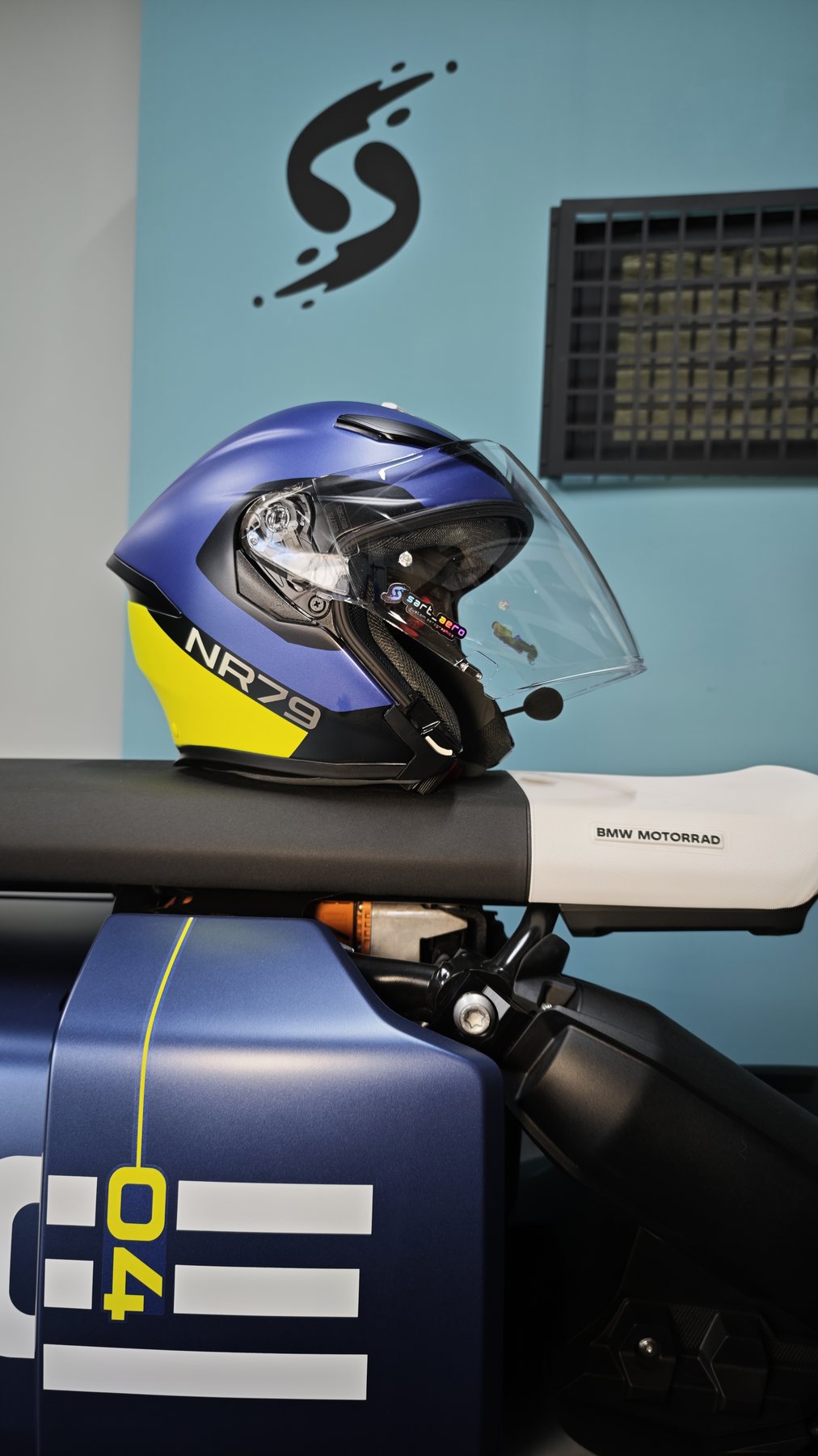 Close-up of the open-face helmet showing the NR79 lettering on the chin bar