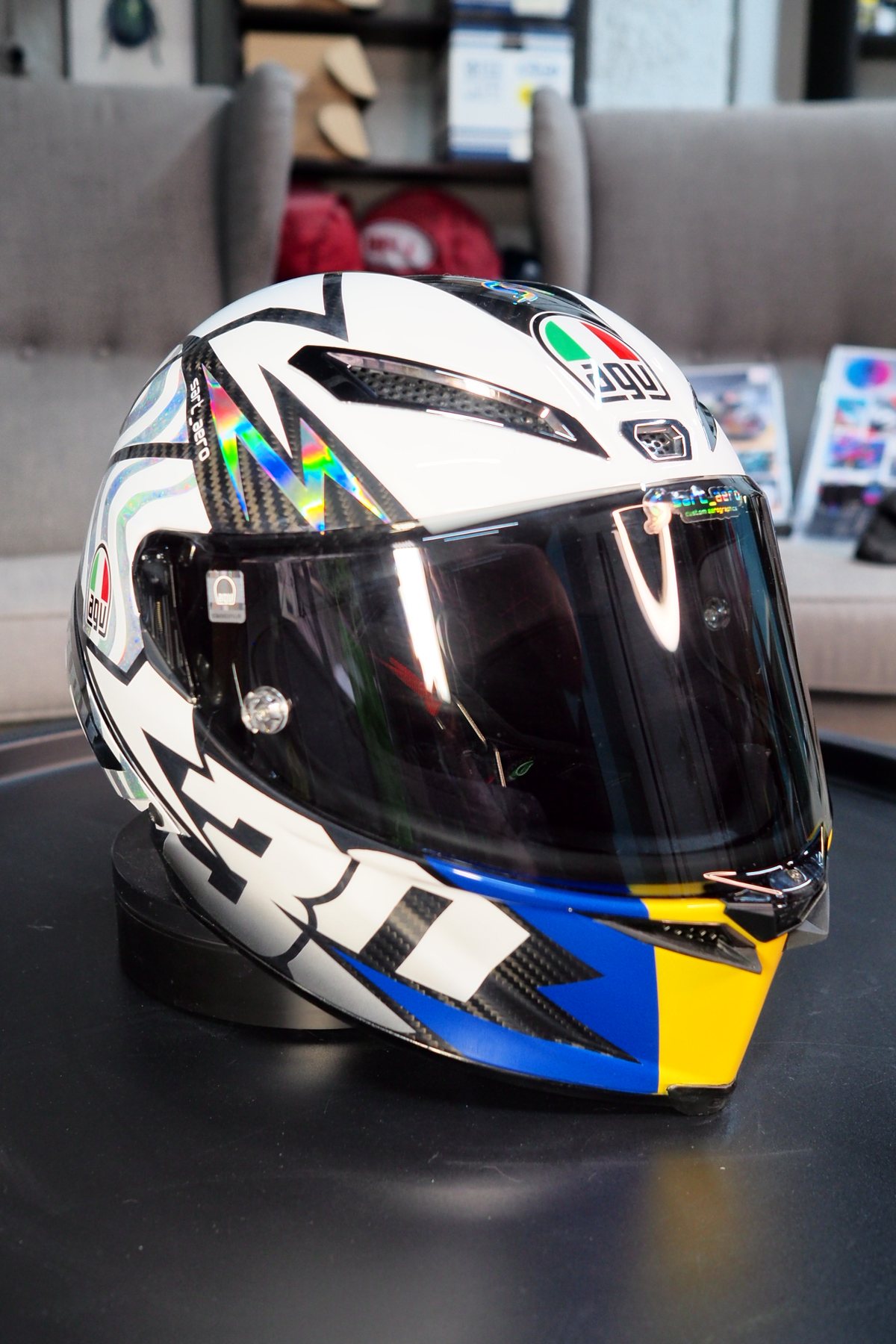 Side profile of the Dadu #30 2026 helmet, white shell with holographic shards and the 30 graphic