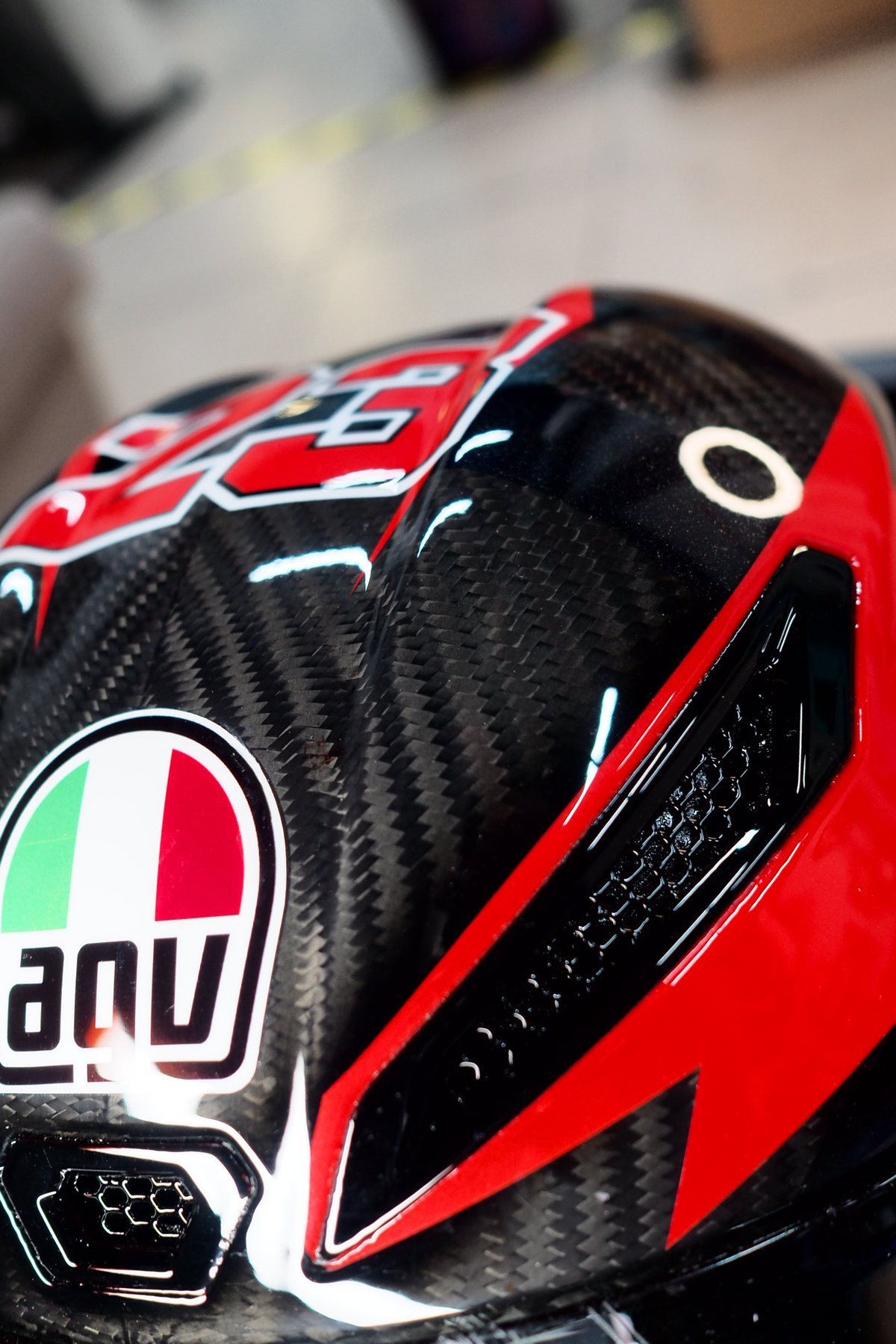 Detail of the side vent with the Italian tricolour beside the AGV badge