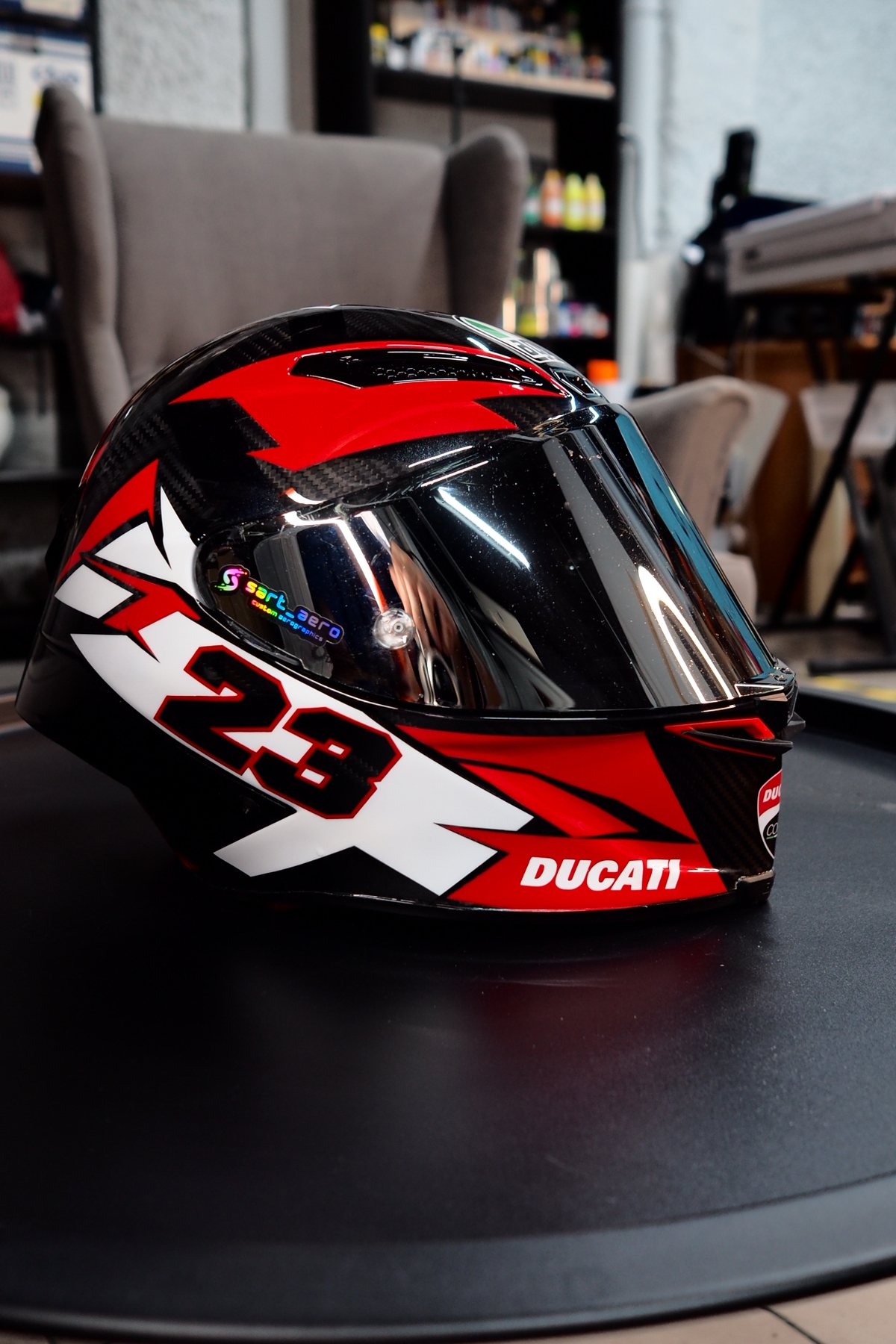 The Ducati #23 helmet on the turntable, seen from the front with the visor down
