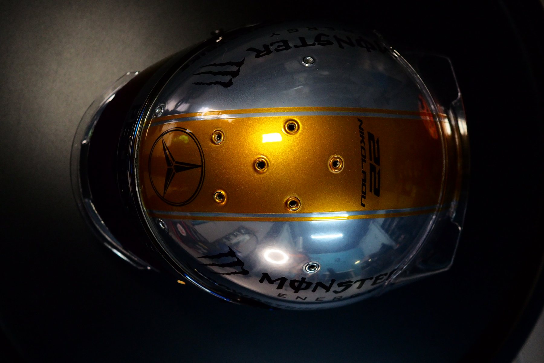 The tribute helmet seen from the front with the gold stripe running over the crown
