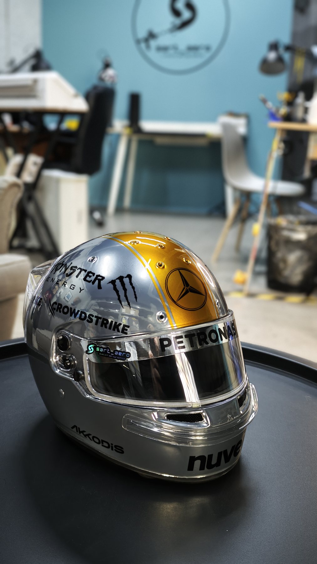 Rear three-quarter view of the chrome shell on the workshop turntable