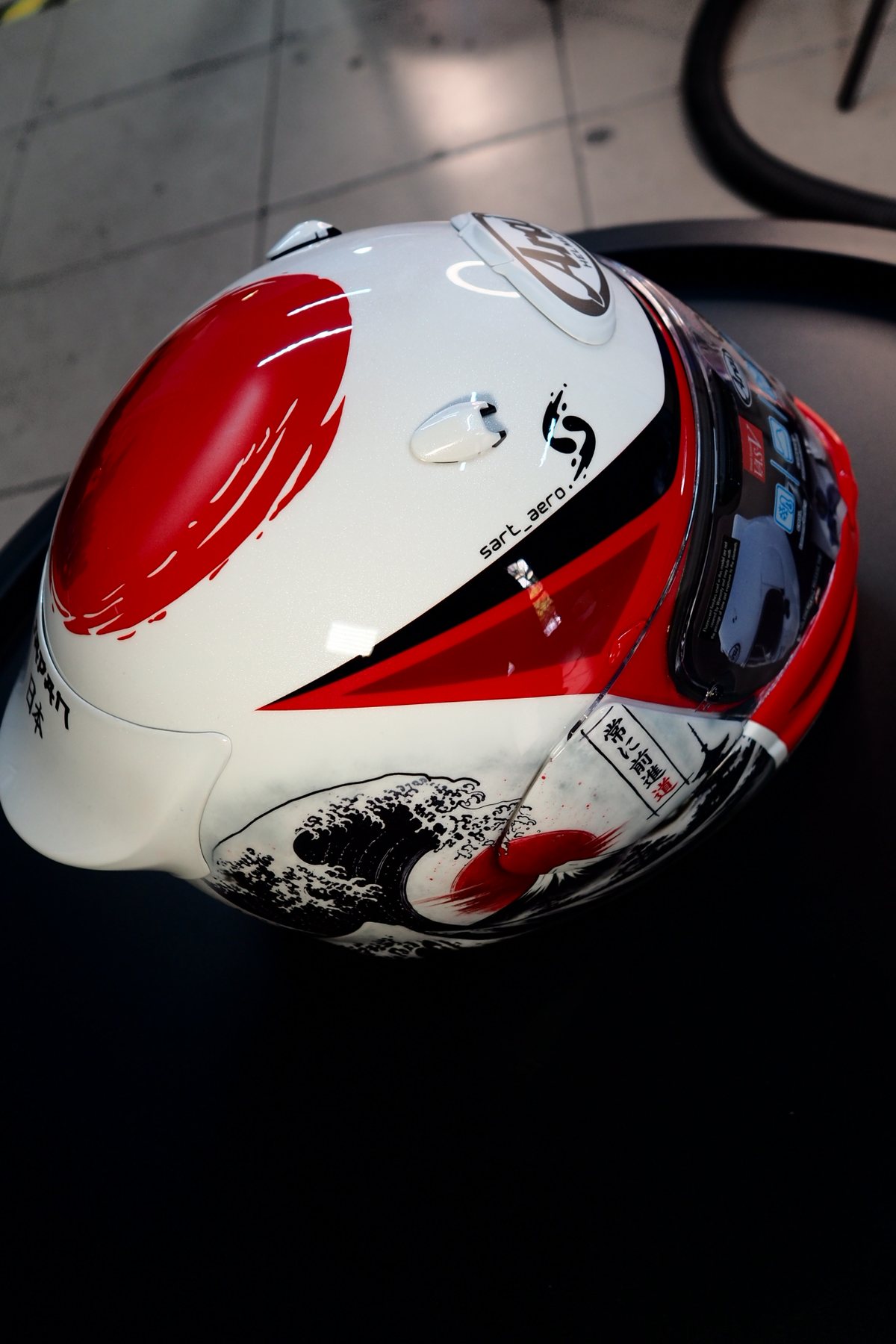 The Japan 2 helmet from the front, showing the red rising-sun disc on the crown