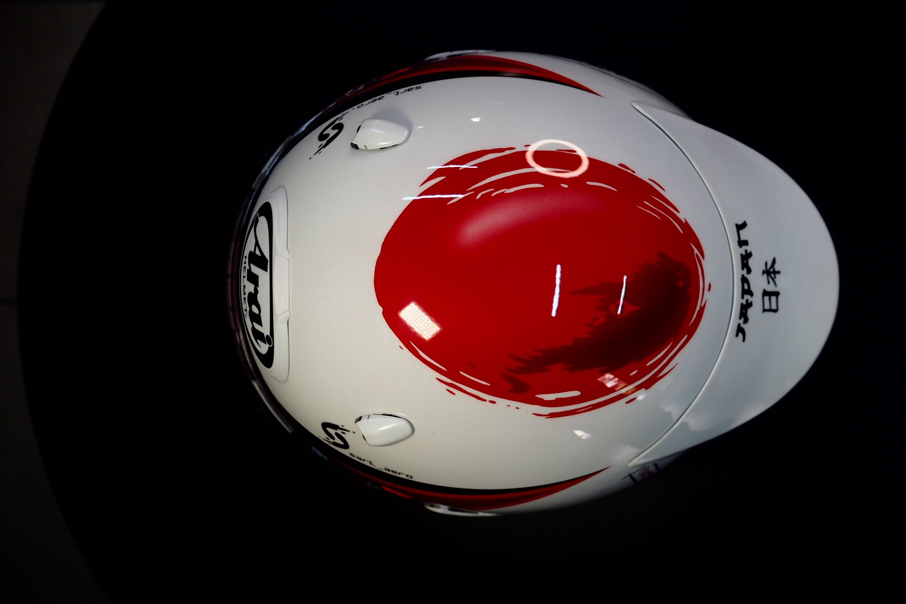 Overhead view of the crown with the red rising-sun disc and JAPAN lettering