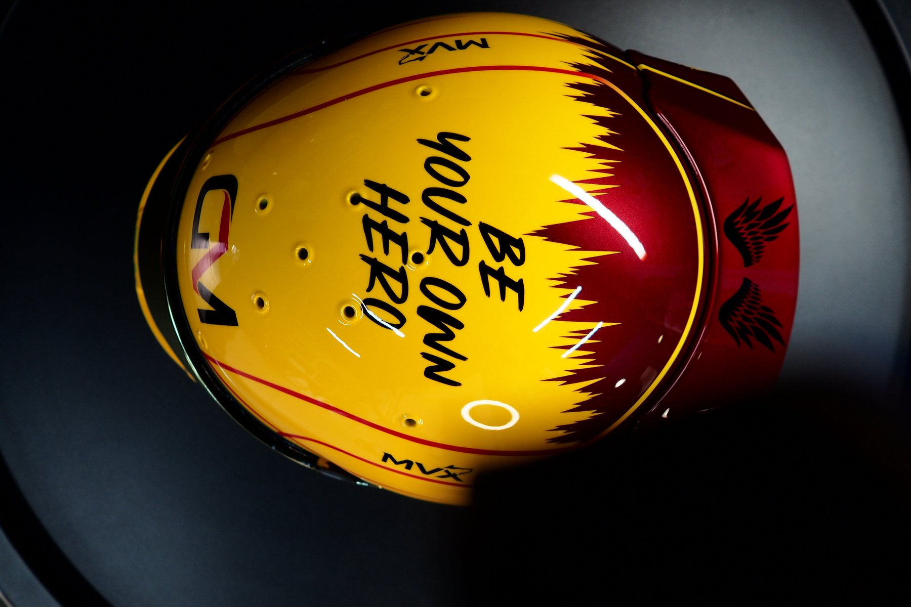 Front view of the helmet with the visor down and the red pinstriping across the crown