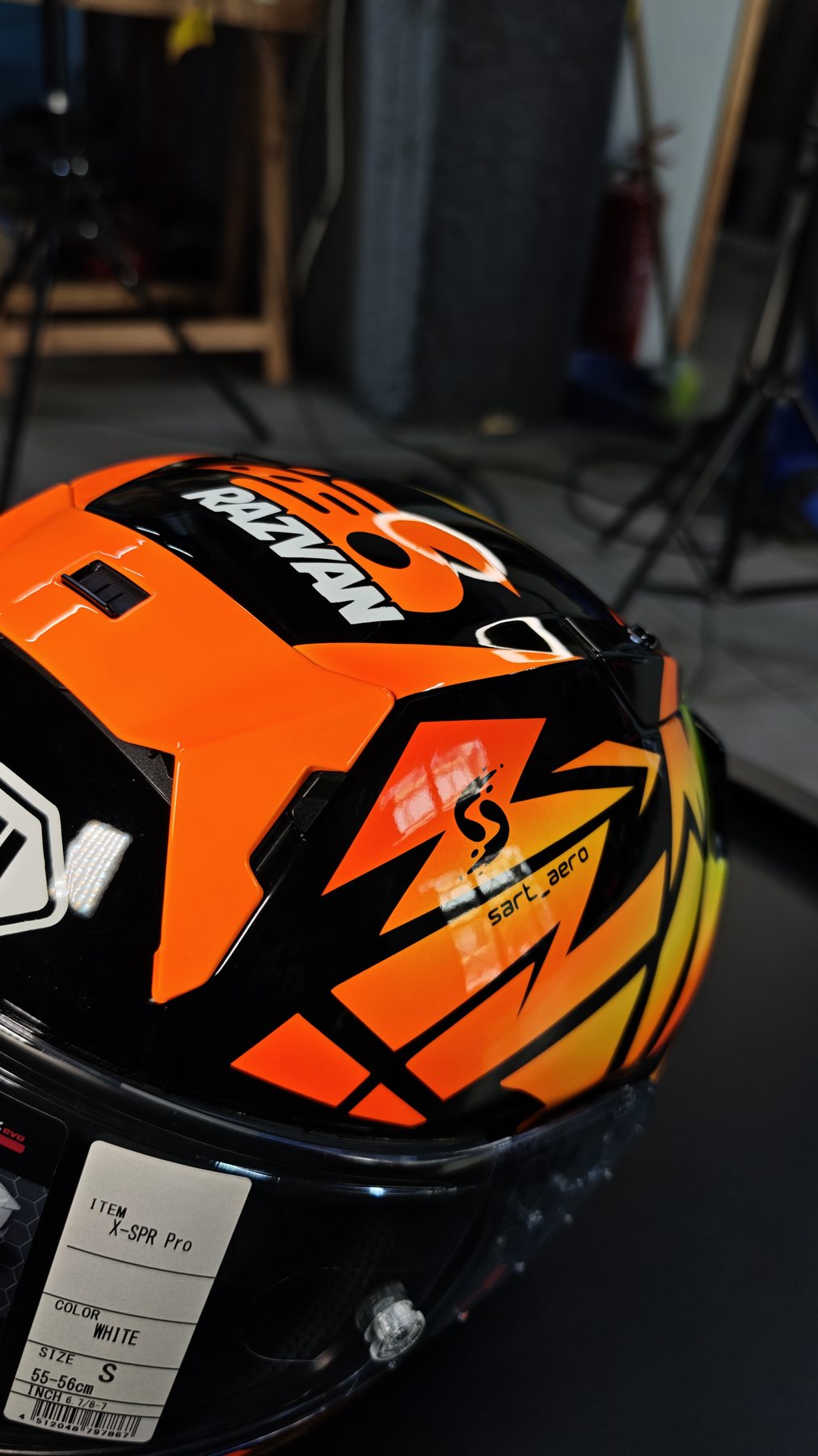 Detail of the rear spoiler with the RAZVAN name in orange