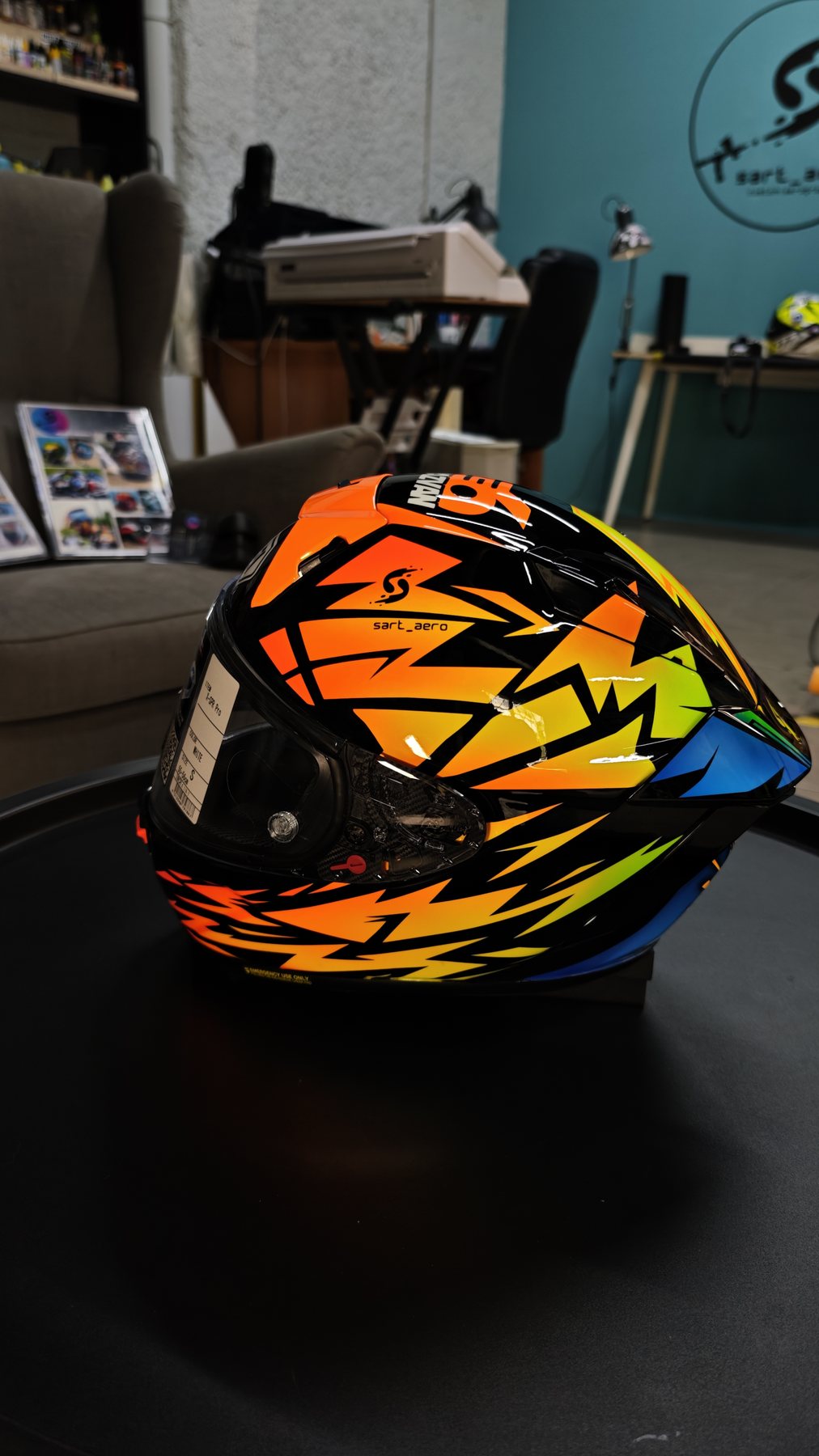 The helmet seen from behind with the blue and yellow THUNDER graphic low on the shell