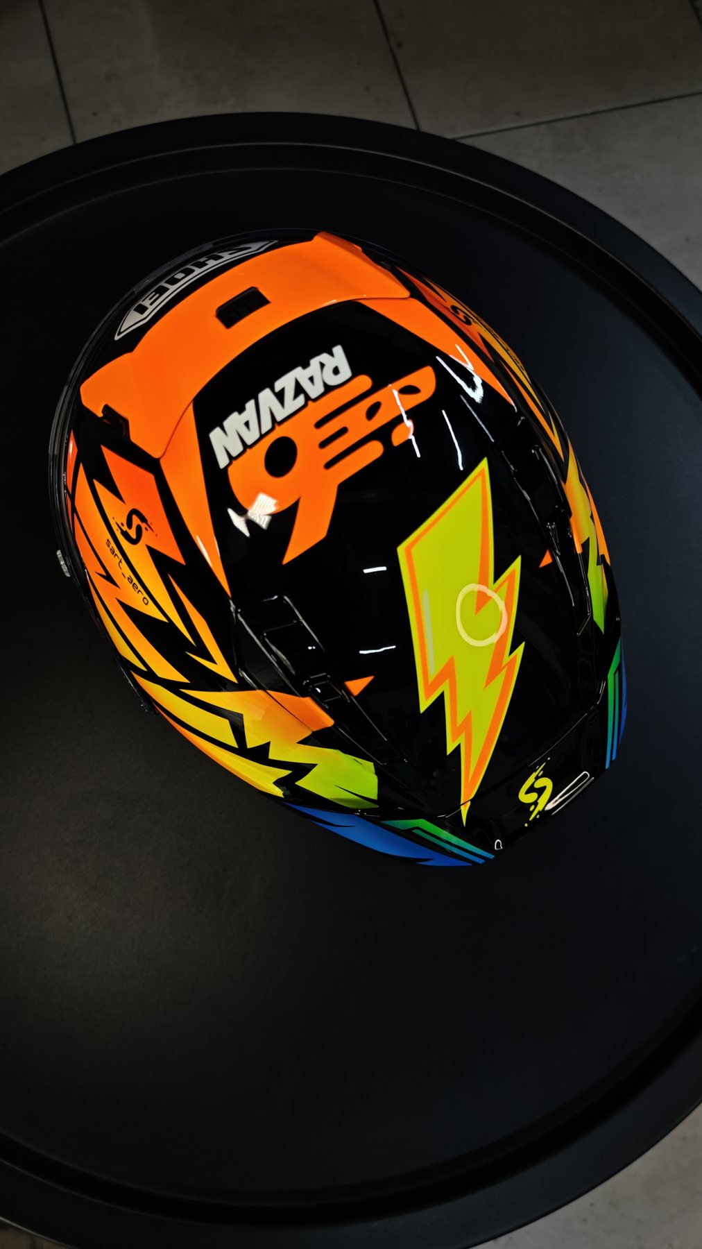 Three-quarter view of the helmet photographed in the workshop