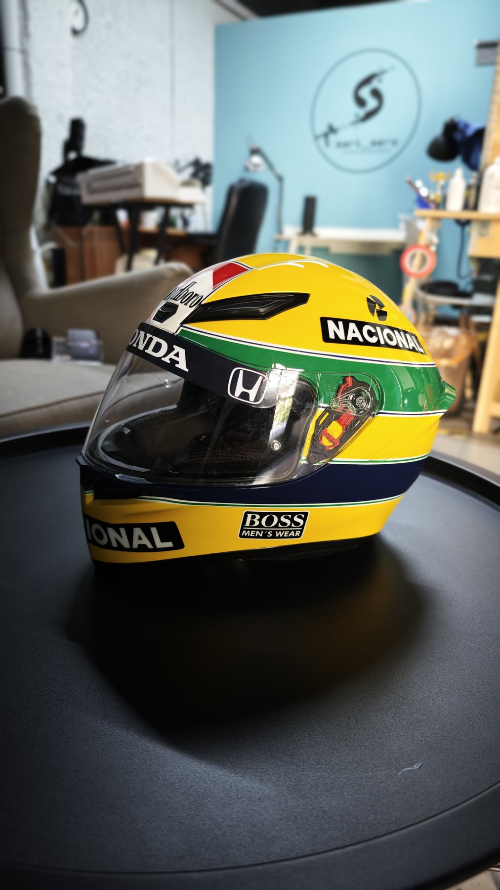 Three-quarter view of the tribute helmet on the workshop turntable