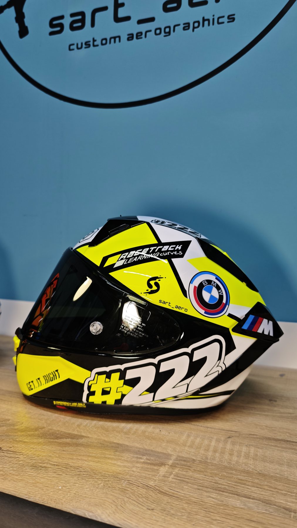 Shai 222 helmet on the bench under the sart_aero workshop sign, showing the 222 side graphic
